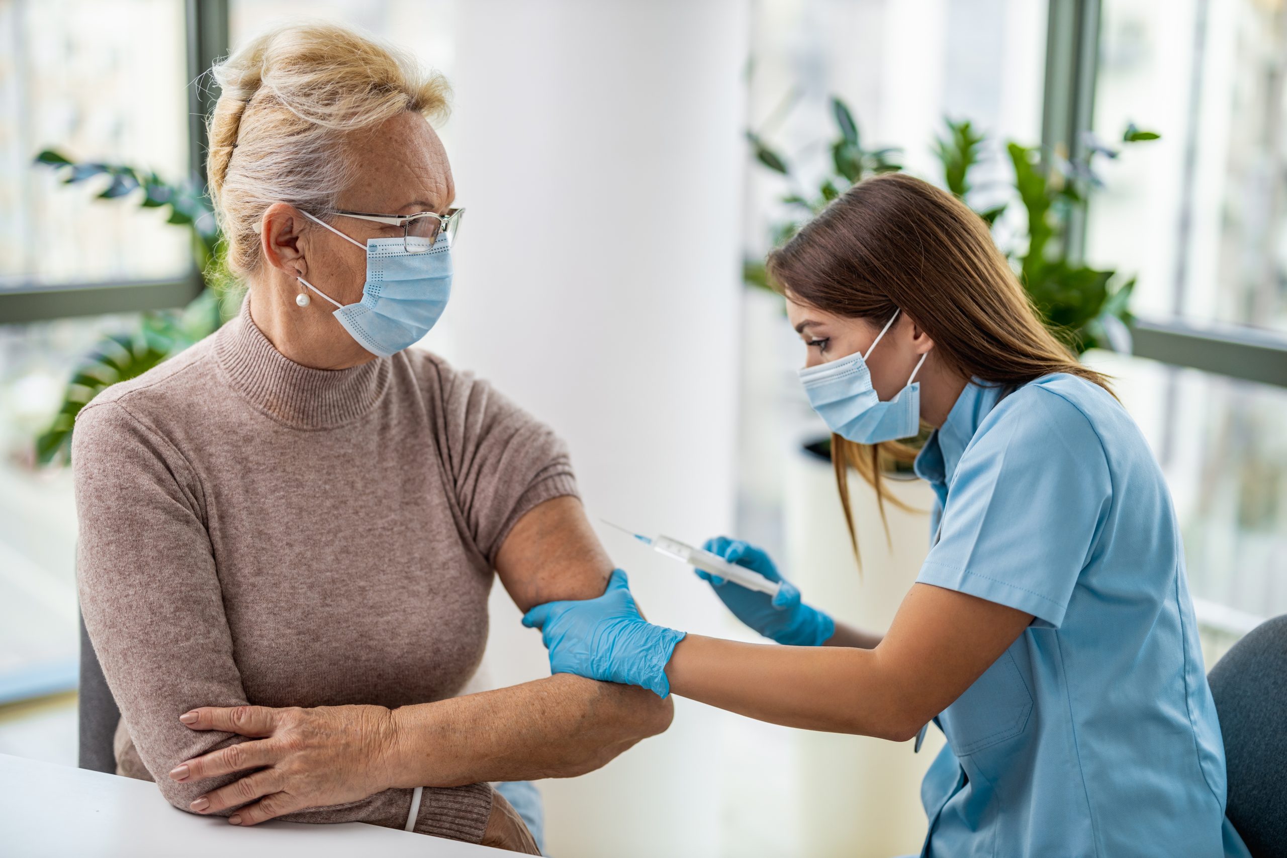 Medical Staff Administering Injection to Patient